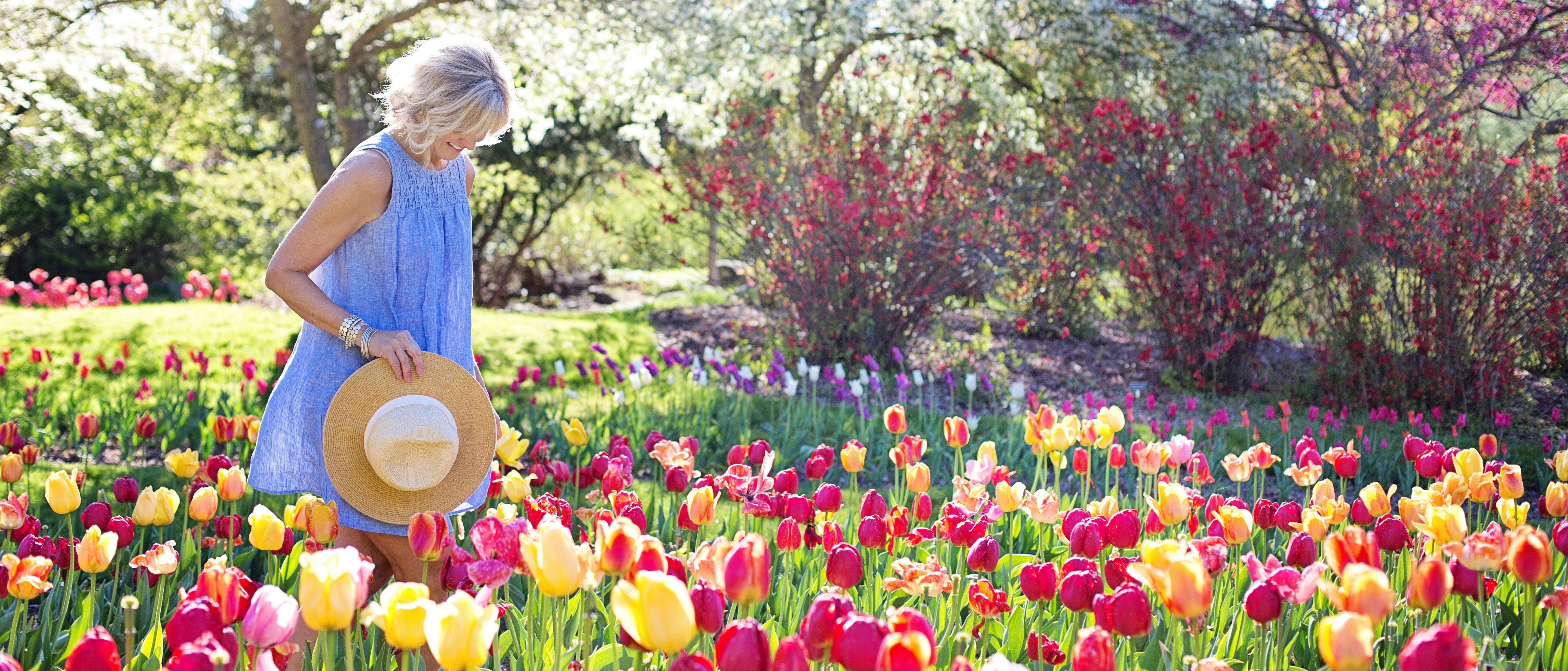 Image of woman walking through flowers